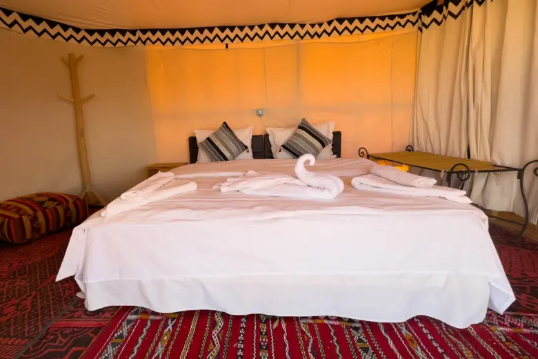 Double bed in an Ame Camp tent