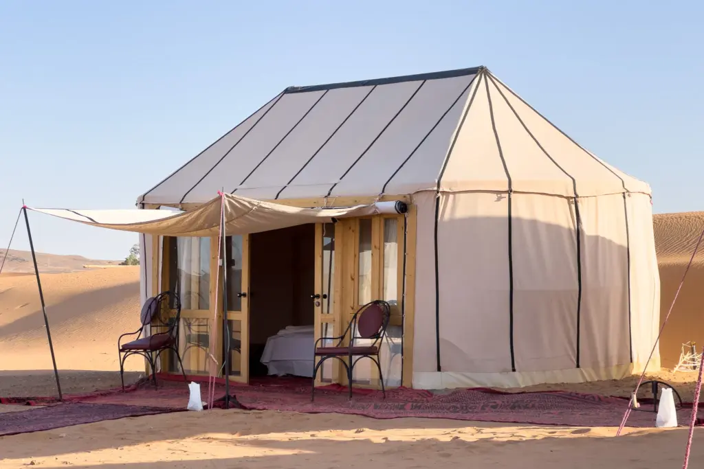 Guest tent at Ame Camp with carpets outside