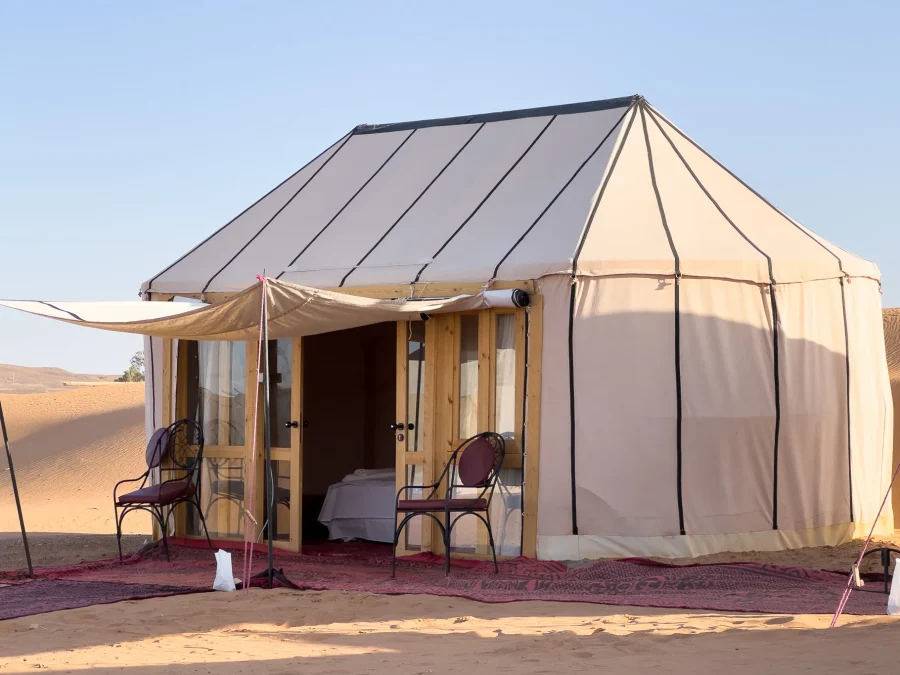 Guest tent at Ame Camp with carpets outside
