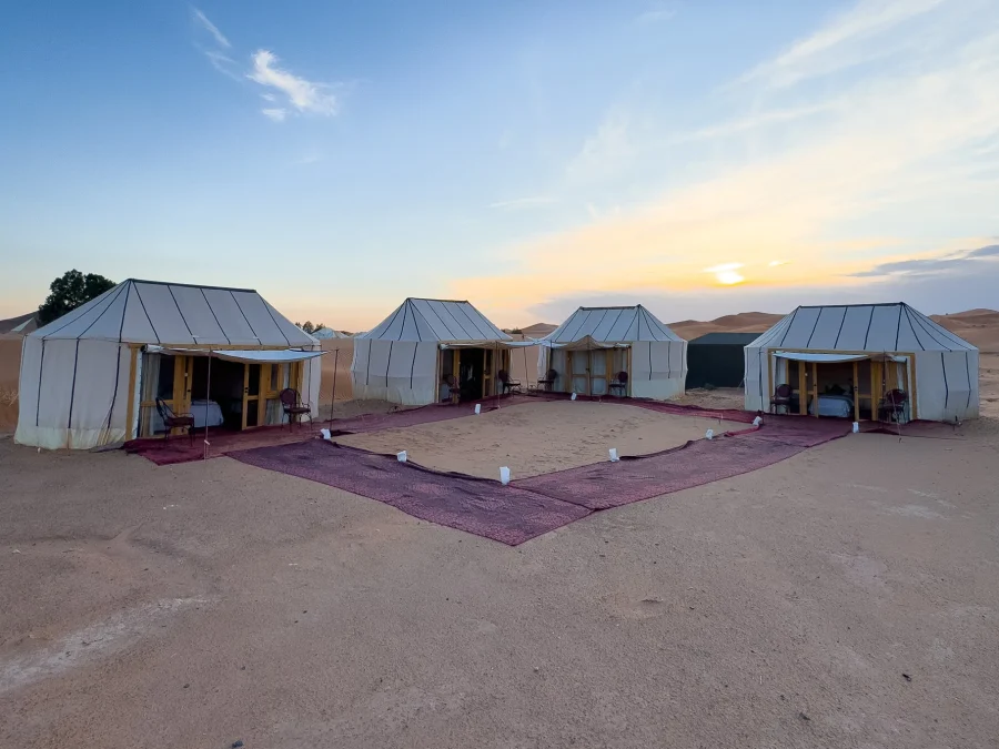 Ame Camp tents around a carpeted courtyard